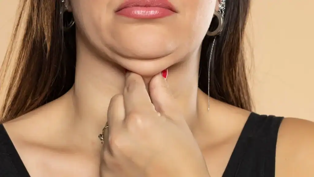 An image of a woman with double chin, sad, worried : Non Surgical Double Chin Removal Treatment in Salisbury, UK